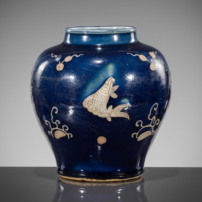 Lot 151 - A BLUE-GLAZED CARVED ‘FISH’ BALUSTER JAR, JIAJING PERIOD, 1521-1567