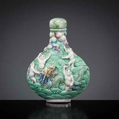 Lot 500 - A MOLDED AND ENAMELED ‘SUBDUING THE DRAGON’ PORCELAIN SNUFF BOTTLE