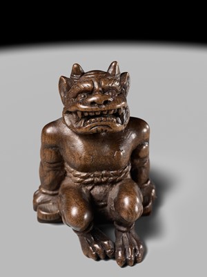 Lot 211 - A RARE WOOD NETSUKE OF A RESTRAINED RAIJIN, CIRCLE OF YORITAKE