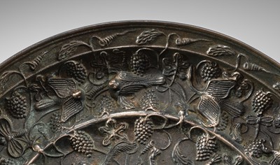 Lot 382 - A LARGE ‘LION AND GRAPEVINE’ BRONZE MIRROR, TANG DYNASTY