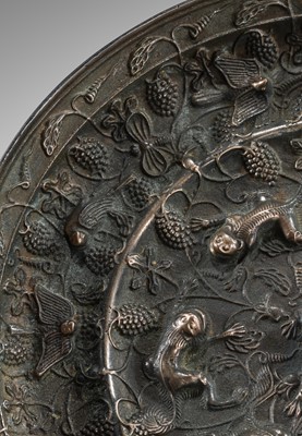 Lot 382 - A LARGE ‘LION AND GRAPEVINE’ BRONZE MIRROR, TANG DYNASTY