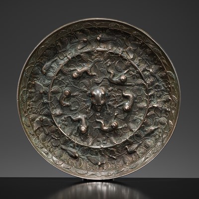 Lot 382 - A LARGE ‘LION AND GRAPEVINE’ BRONZE MIRROR, TANG DYNASTY