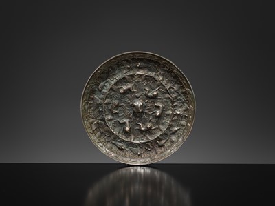 Lot 382 - A LARGE ‘LION AND GRAPEVINE’ BRONZE MIRROR, TANG DYNASTY