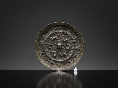 Lot 382 - A LARGE ‘LION AND GRAPEVINE’ BRONZE MIRROR, TANG DYNASTY