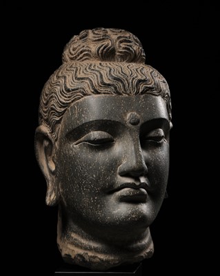 Lot 611 - A GRAY SCHIST HEAD OF BUDDHA, ANCIENT REGION OF GANDHARA, 2ND-3RD CENTURY