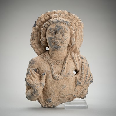 Lot 384 - A SCHIST BUST OF A DEITY, GANDHARA, 1ST - 5TH CENTURY AD