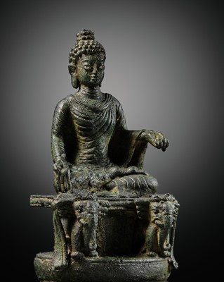 Lot 360 - A SILVER-INLAID BRONZE FIGURE OF BUDDHA ON AN ELEPHANT THRONE, SWAT VALLEY, 8TH-9TH CENTURY