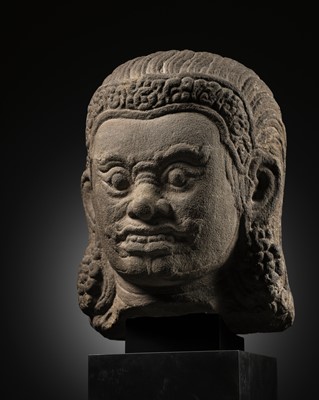 Lot 269 - A SANDSTONE HEAD OF DVARAPALA, BAYON STYLE, 12TH-13TH CENTURY