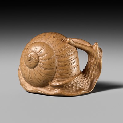 Lot 286 - GYOKUSUI: A RARE WOOD NETSUKE OF A SNAIL WITH INSCRIBED POEM