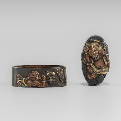 Lot 579 - YASUYOSHI: A FINE SHIBUICHI FUCHI AND KASHIRA WITH RAIJIN AND ONI