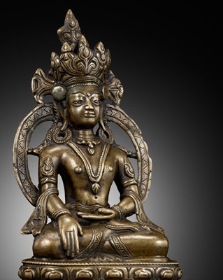 Lot 12 - A BRONZE FIGURE OF AKSHOBHYA, WESTERN TIBET, 13TH-14TH CENTURY