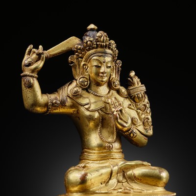 Lot 296 - A GILT BRONZE FIGURE OF MANJUSHRI, TIBET, 19TH CENTURY