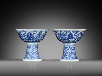 Lot 168 - AN EXCEEDINGLY RARE PAIR OF BLUE AND WHITE ‘EIGHT IMMORTALS’ STEM BOWLS, DAOGUANG MARK AND PERIOD, DATED 1845