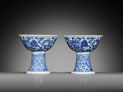 Lot 168 - AN EXCEEDINGLY RARE PAIR OF BLUE AND WHITE ‘EIGHT IMMORTALS’ STEM BOWLS, DAOGUANG MARK AND PERIOD, DATED 1845