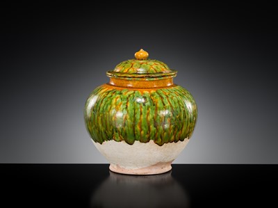 Lot 136 - A SANCAI SPLASHED POTTERY JAR AND COVER, TANG DYNASTY