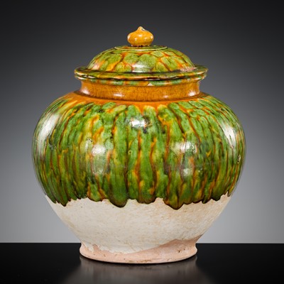 Lot 136 - A SANCAI SPLASHED POTTERY JAR AND COVER, TANG DYNASTY