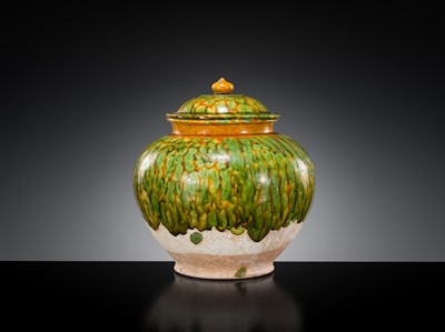 Lot 136 - A SANCAI SPLASHED POTTERY JAR AND COVER, TANG DYNASTY