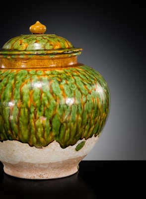 Lot 136 - A SANCAI SPLASHED POTTERY JAR AND COVER, TANG DYNASTY