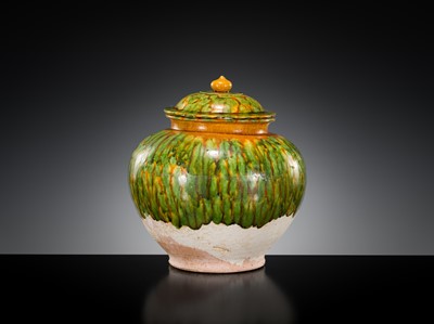 Lot 136 - A SANCAI SPLASHED POTTERY JAR AND COVER, TANG DYNASTY