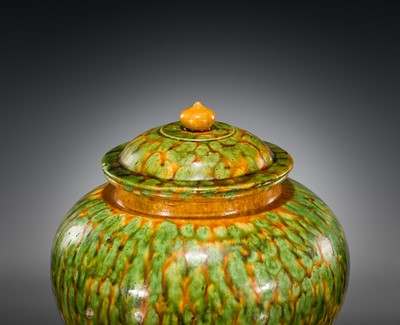 Lot 136 - A SANCAI SPLASHED POTTERY JAR AND COVER, TANG DYNASTY