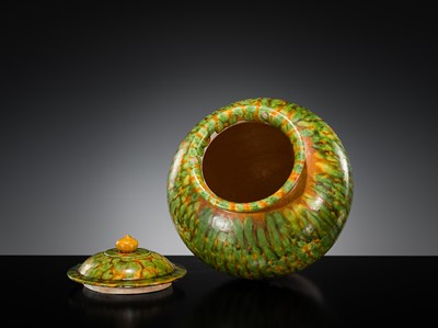 Lot 136 - A SANCAI SPLASHED POTTERY JAR AND COVER, TANG DYNASTY