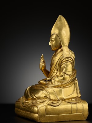 Lot 26 - A GILT-BRONZE FIGURE OF THE SIXTH PANCHEN LAMA, LOBZANG PALDEN YESHE