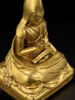 Lot 26 - A GILT-BRONZE FIGURE OF THE SIXTH PANCHEN LAMA, LOBZANG PALDEN YESHE