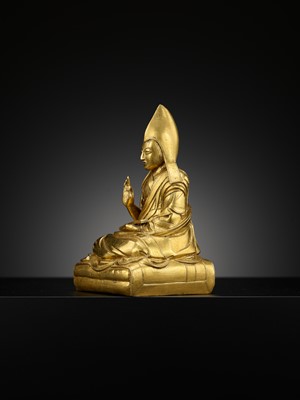 Lot 26 - A GILT-BRONZE FIGURE OF THE SIXTH PANCHEN LAMA, LOBZANG PALDEN YESHE