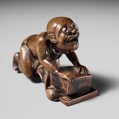 Lot 202 - ISSEKI: AN UNUSUAL WOOD NETSUKE OF A BLIND RAT CATCHER