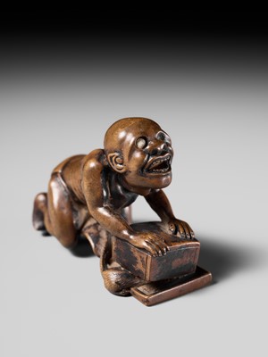 Lot 202 - ISSEKI: AN UNUSUAL WOOD NETSUKE OF A BLIND RAT CATCHER