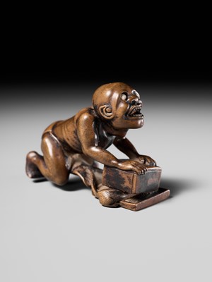 Lot 202 - ISSEKI: AN UNUSUAL WOOD NETSUKE OF A BLIND RAT CATCHER