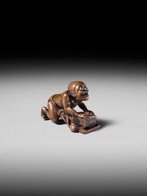 Lot 202 - ISSEKI: AN UNUSUAL WOOD NETSUKE OF A BLIND RAT CATCHER