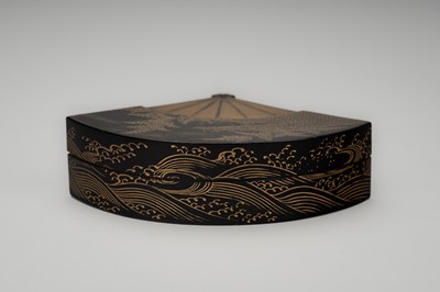 Lot 100 - A BLACK AND GOLD LACQUER FAN-SHAPED KOGO (INCENSE BOX) AND COVER