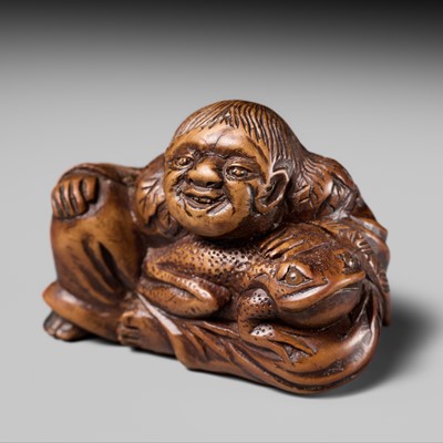 Lot 193 - TOSUI: A WOOD NETSUKE OF GAMA SENNIN WITH HIS TOAD