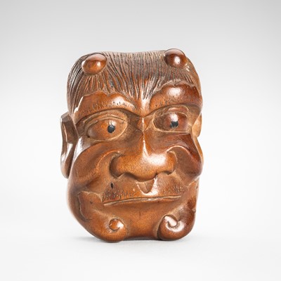 Lot 1807 - TAMAGAWA TOSHIMITSU: A BOXWOOD MASK NETSUKE OF AN ONI