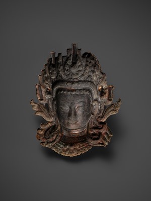 Lot 312 - A GILT-COPPER REPOUSSÉ LINGA COVER WITH THE FACE OF SHIVA, MALLA PERIOD, NEPAL, 15TH-16TH CENTURY