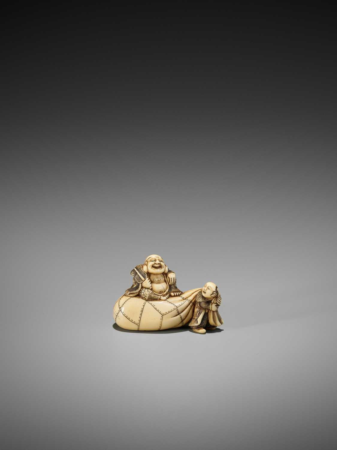 Lot 46 - AN IVORY NETSUKE OF HOTEI ON HIS TREASURE BAG BEING PULLED BY A KARAKO