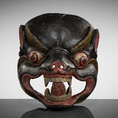 Lot 320 - A MONPA ‘WILD BOAR’ RITUAL WOOD MASK, PHAG GOCHEN, 18TH-19TH CENTURY