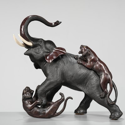 Lot 51 - TSUNEMITSU: A LARGE INLAID BRONZE OKIMONO OF AN ELEPHANT FIGHTING OFF TWO TIGERS