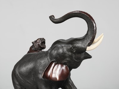 Lot 51 - TSUNEMITSU: A LARGE INLAID BRONZE OKIMONO OF AN ELEPHANT FIGHTING OFF TWO TIGERS