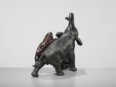 Lot 51 - TSUNEMITSU: A LARGE INLAID BRONZE OKIMONO OF AN ELEPHANT FIGHTING OFF TWO TIGERS