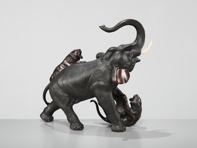Lot 51 - TSUNEMITSU: A LARGE INLAID BRONZE OKIMONO OF AN ELEPHANT FIGHTING OFF TWO TIGERS