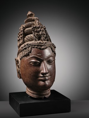 Lot 195 - A RED SANDSTONE HEAD OF VISHNU, WESTERN RAJASTHAN, 12TH-13TH CENTURY