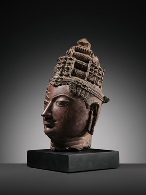 Lot 195 - A RED SANDSTONE HEAD OF VISHNU, WESTERN RAJASTHAN, 12TH-13TH CENTURY