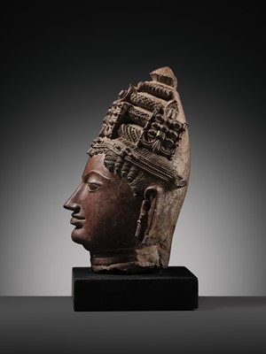Lot 195 - A RED SANDSTONE HEAD OF VISHNU, WESTERN RAJASTHAN, 12TH-13TH CENTURY