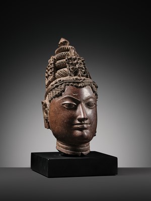 Lot 195 - A RED SANDSTONE HEAD OF VISHNU, WESTERN RAJASTHAN, 12TH-13TH CENTURY