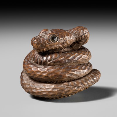 Lot 122 - MINKO: A RARE WOOD NETSUKE OF A SNAKE COILING AROUND A TAMA