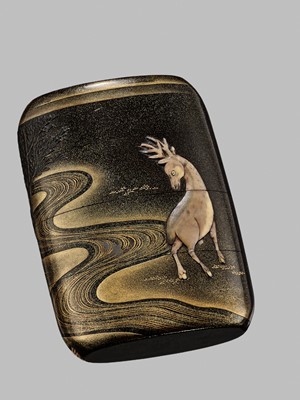 Lot 42 - A FINE BUFFALO HORN-INLAID THREE-CASE INRO OF A DEER AT NIGHT IN KASUGA PARK, NARA