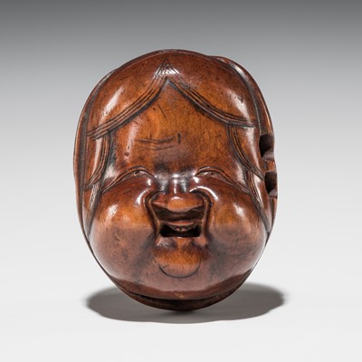 Lot 550 - A RARE WOOD NETSUKE OF TWO AN OKAME AND BAKEMONO MASK