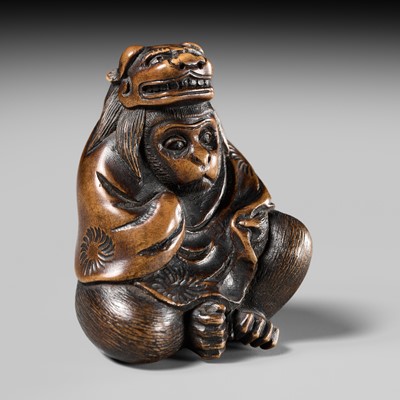 Lot 176 - MASATAMI: A FINE WOOD NETSUKE OF A MONKEY WITH SHISHIMAI MASK